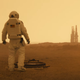 An astronaut, presumably Pitt’s character, staring out at an installation in the far distance.